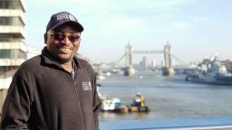 Donnie Mategula standing in front of the river Thames